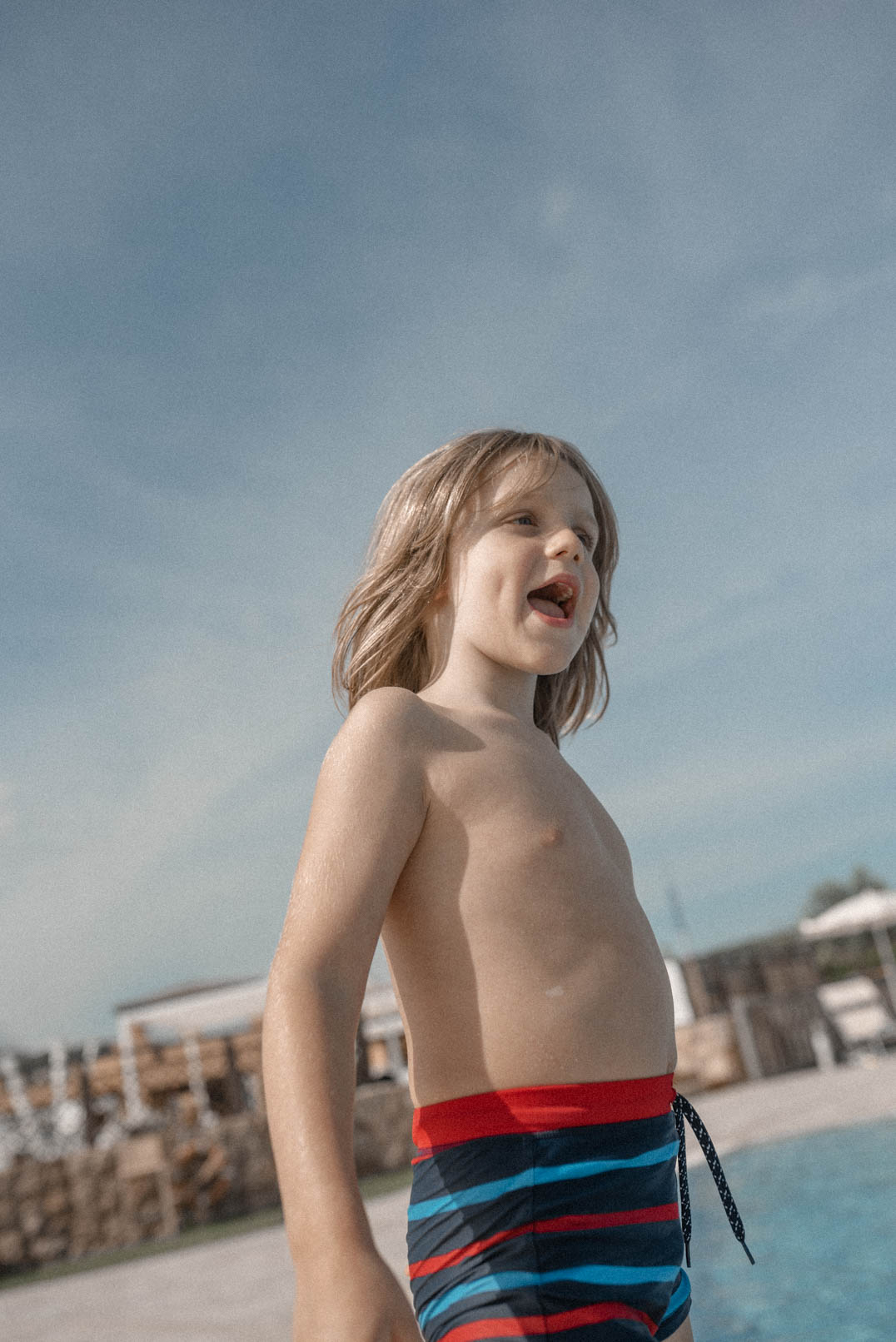 Travels with Autism - An Unofficial guide - Charlie by the pool in Sardinia