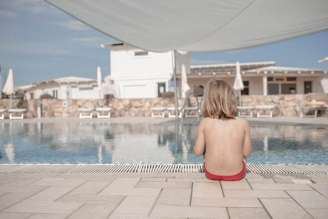 Travels with Autism - An unofficial guide - Charlie sitting by the pool