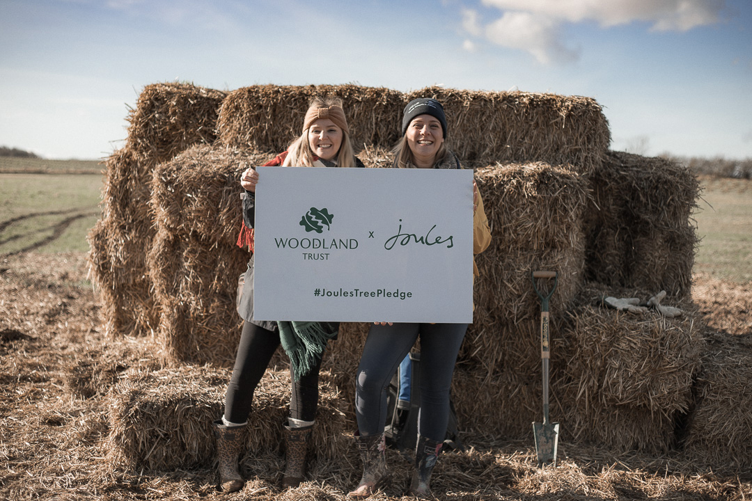 Joules Tree Planting - Beth Anne and Holly Made Lie holding a tree planting sign